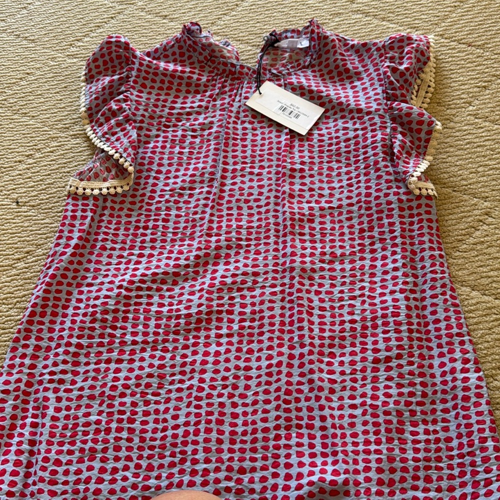 Adorable T. H. M. L. Shirt. Never been worn.
